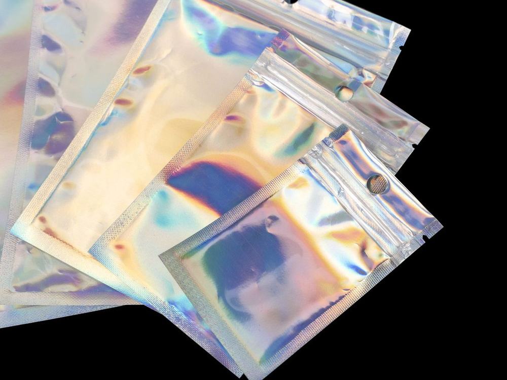 Metallised and laser-effect zip pouches with high shelf impact